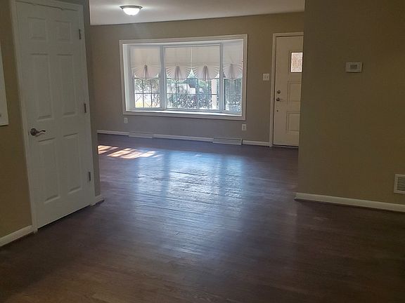 View from dining room to living room and front door.
