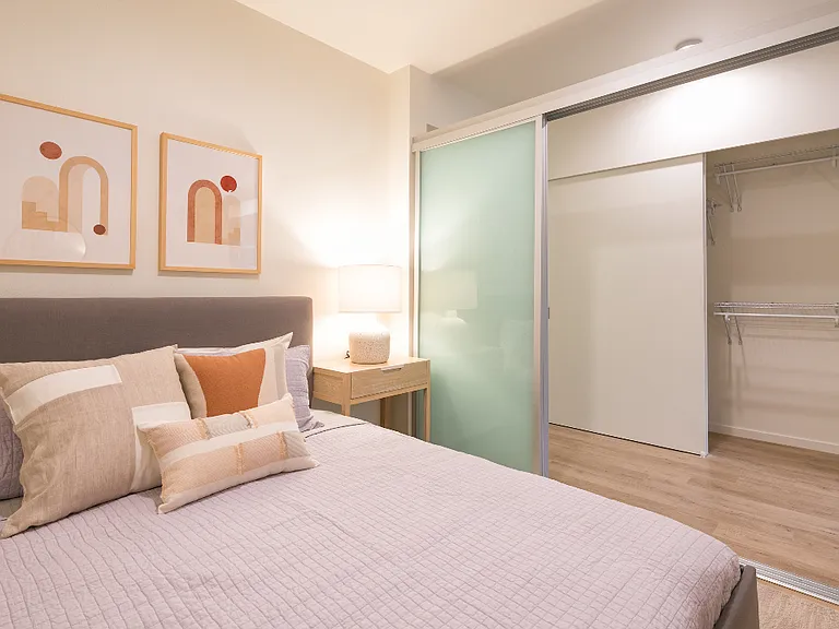 Bedroom with view of sliding privacy door