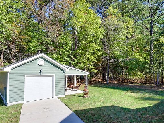 Oversized Detached Garage with a Lanai for backyard entertaining. 