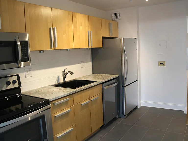 Kitchen with new appliances and tiles