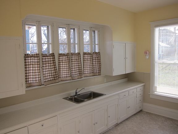One view of the kitchen. There is more storage cupboards and