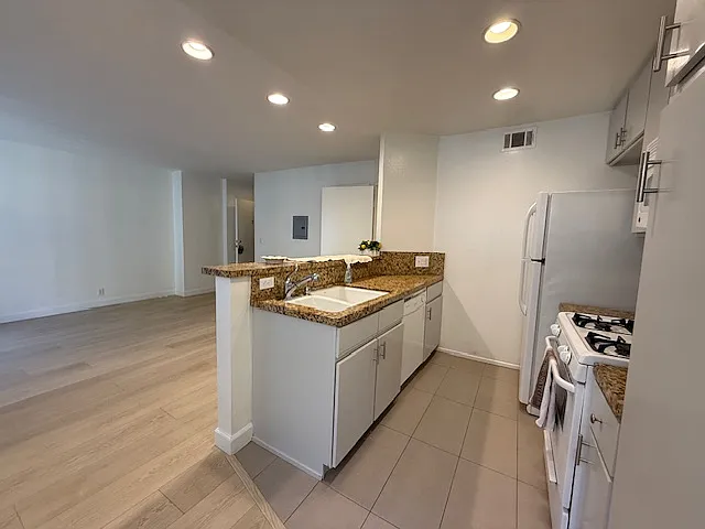 Kitchen- New vinyl wood floors throughout
