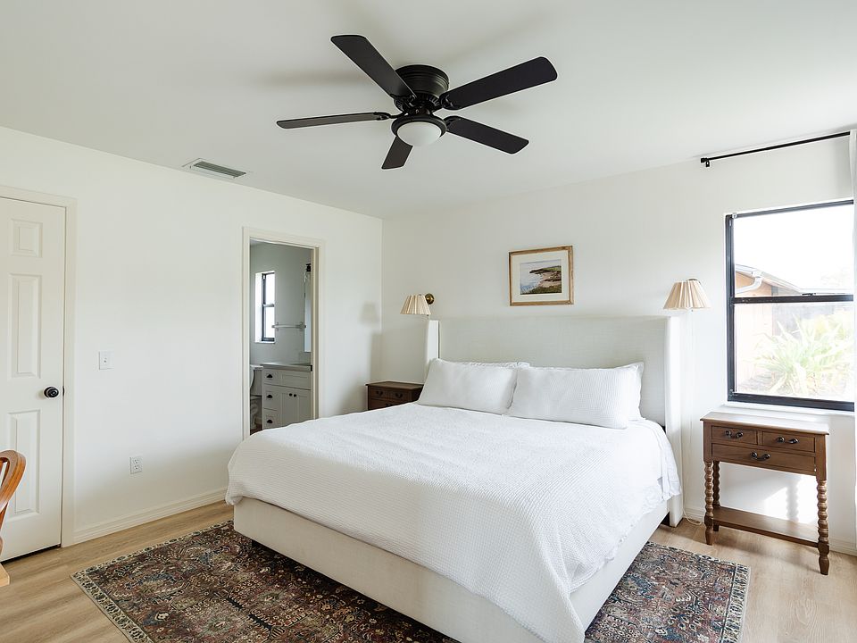 Primary bathroom with very king size bed. Has access to bathroom.