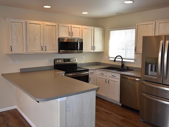 Great kitchen with new stainless steel appliances and custom painted cabinets. Note the USB connections for charging devices in the outlet.