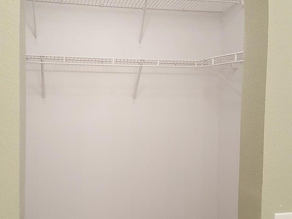 Walk in closet with master room