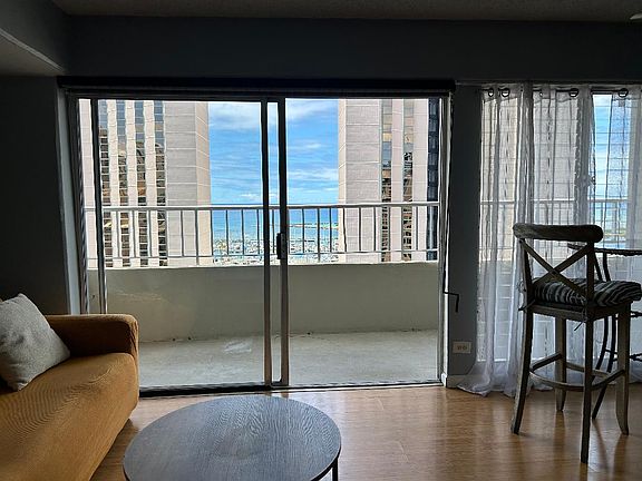 Living Area with Views of Ocean and Ala Wai Yacht Harbor.