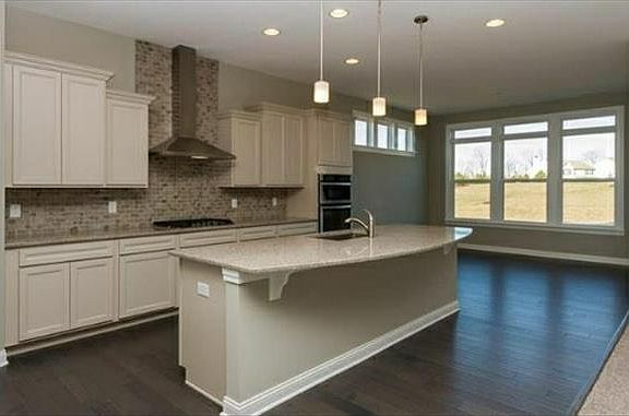 Large center island with quartz countertop