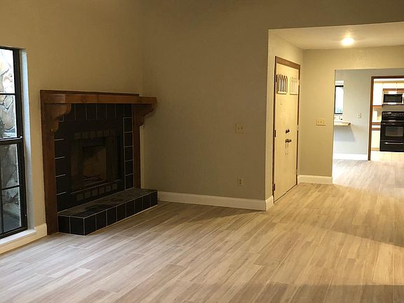 Fireplace in living room - looking towards kitchen