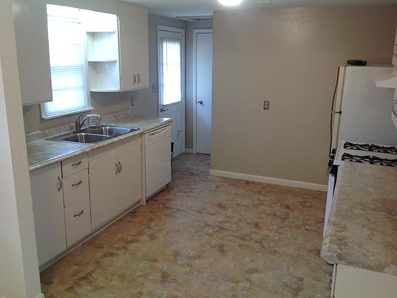 Kitchen with pantry storage and dishwasher