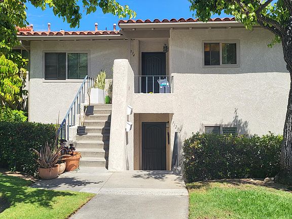 Many parking space in front of the condo except 2 car garage