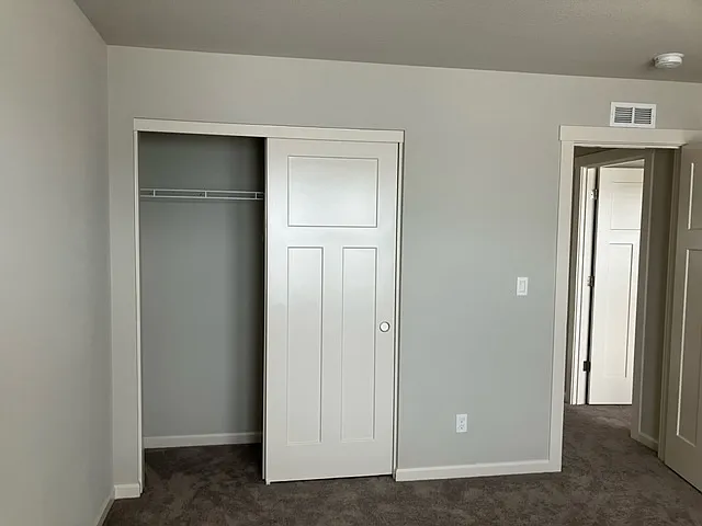 Secondary Bedroom B open closet doors