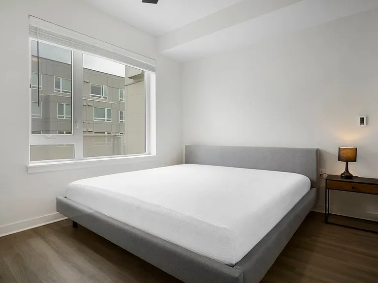 Furnished+ apartment homes feature queen bed with mattress, dresser, nightstands, and lamps (Representative Image exact items and style of furnishings may vary)