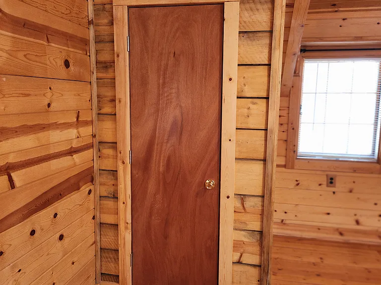 The Bedroom closet is very deep and features several poles for hanging your clothing.
