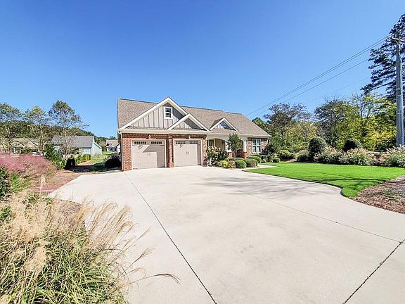 Large two car garage with extra parking in the driveway.