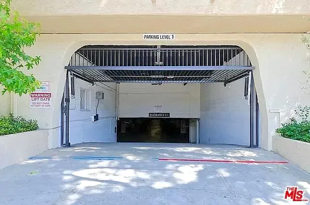 Gated garage entry with 1 assigned parked space