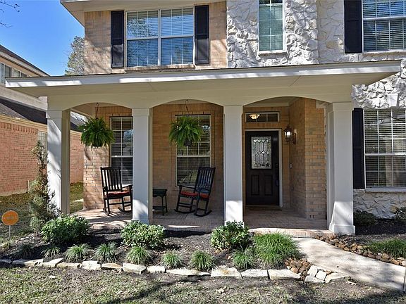 Spacious front porch perfect to sit out on and relax.