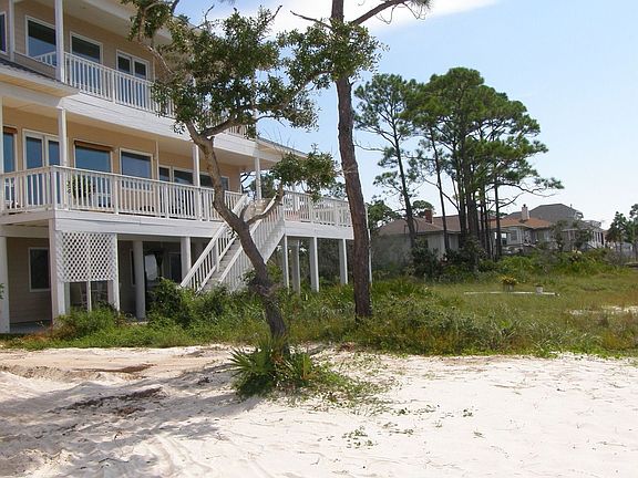 Take long walks on miles of undeveloped white beach to the bird sanctuary