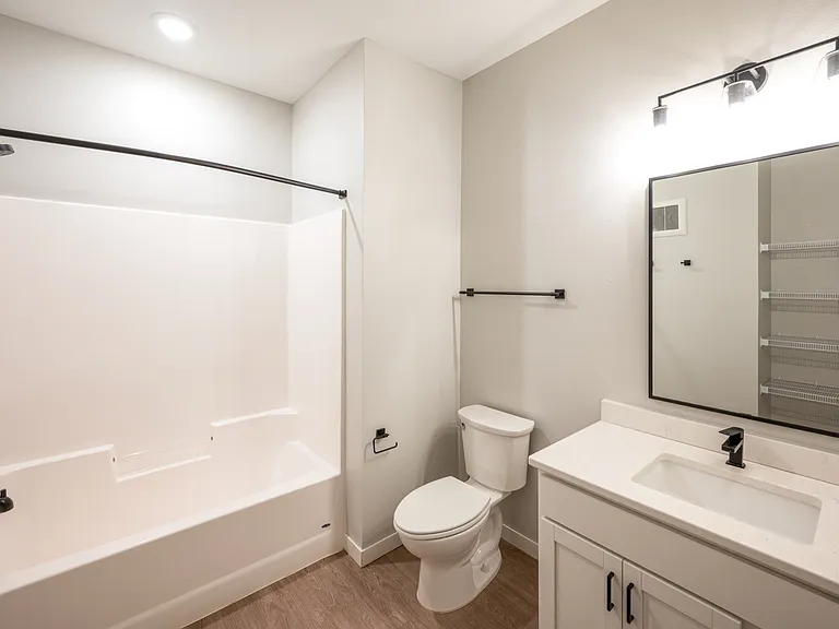 Modern bathroom featuring a sleek bathtub, elegant vanity, and contemporary lighting, perfect for relaxation. Modern bathroom featuring a sleek bathtub, elegant vanity, and contemporary lighting, perfect for relaxation.