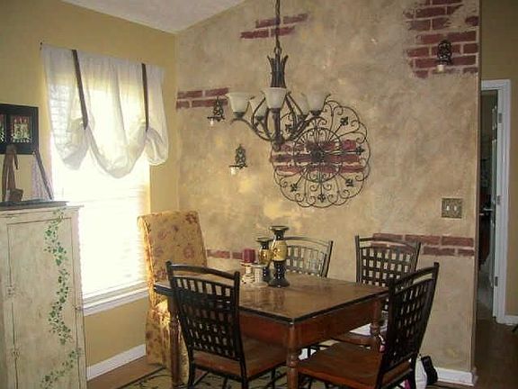 dining area with professionally faux painted wall