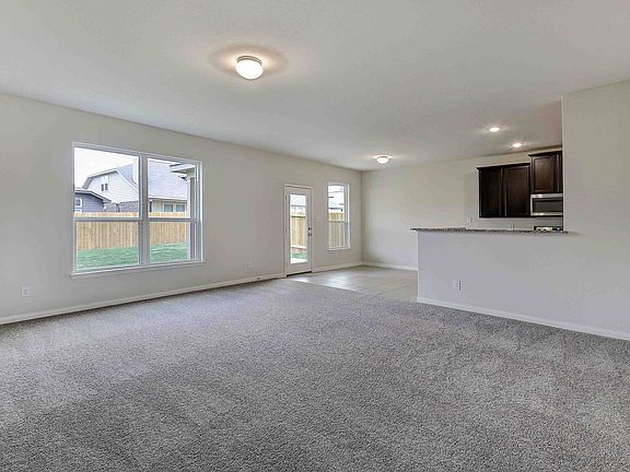 The living area has great natural light and plenty of space for entertaining