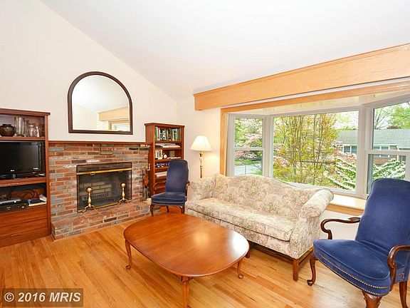 Large bay window floods the room with light