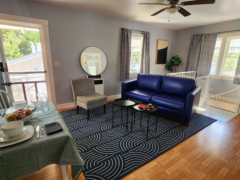 The second story entrance opens into a charming living/dining room with built-ins and plenty of windows.