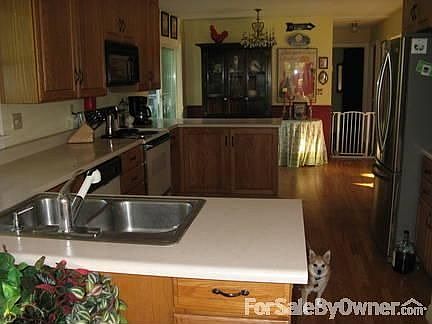 Kitchen : Open kitchen allows for meal preparation while entertaining.