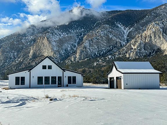 4 scenic acres at the base of the Chalk Cliffs. Ample parking in the oversized 2 car garage and RV hookup as well.