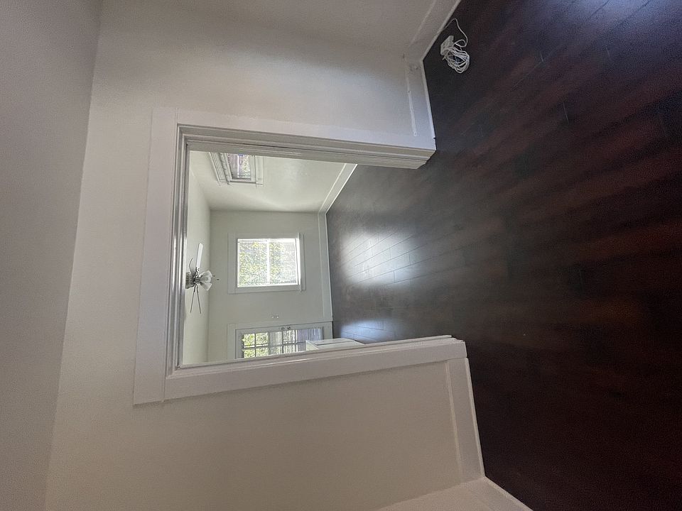 Hardwood floors in front room looking towards kitchen at The Villas in Pasadena, CA.