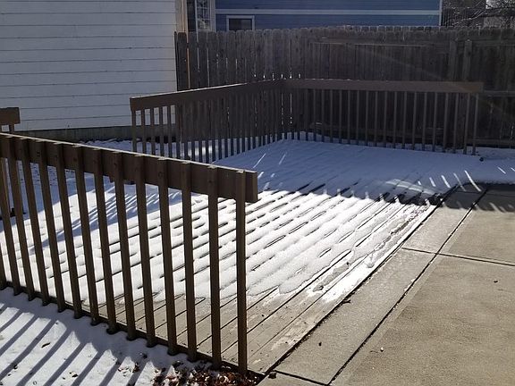 Another view of spacious back deck showing fenced back yard