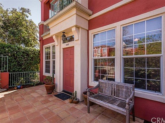 Front entry of home features a tile patio space (approximately 180 sqft).