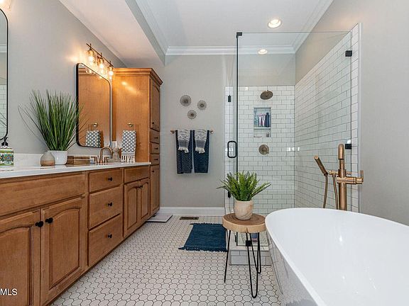 Master bathroom with soaker tub, walk-in shower and toilet closet