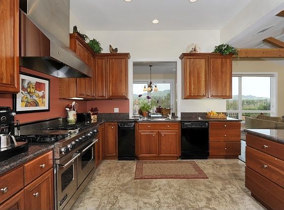 Gourmet kitchen with cherry cabinetry, granite counters and Viking oven/stove.