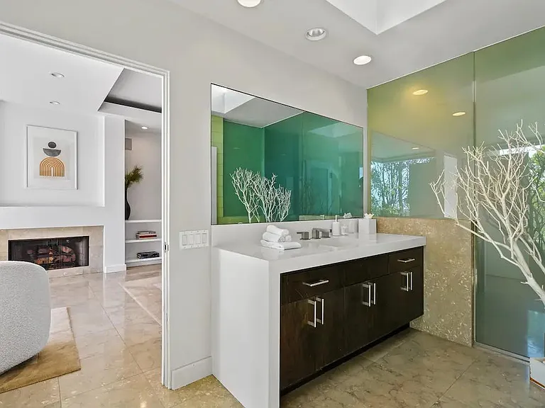 Embrace the warmth and elegance of a fireplace right in the primary bedroom.