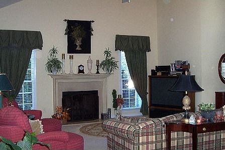 Large family room w/marble fireplace, vaulted ceiling 