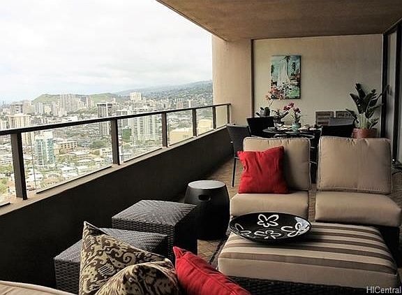 Covered lanai functions as an outdoor family room