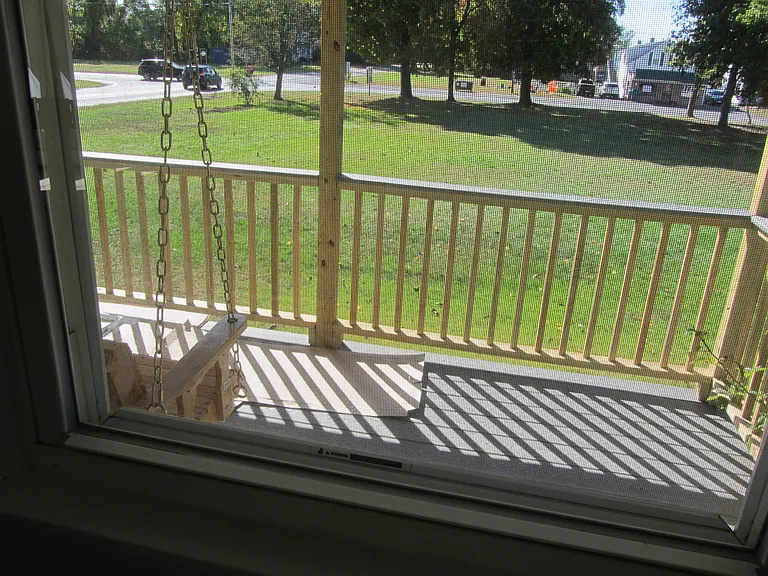 Looking out at the porch from one of the bedrooms.
