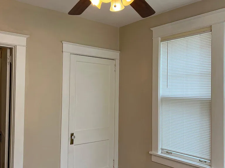 Bedroom closet and side window view