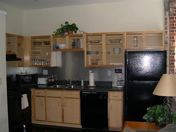 Cabinets are white, after reno, and stainless steel refrigerator and dishwasher. Pictures coming soon.