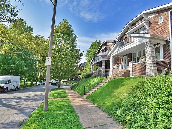 Front of building, well-kept & all-brick on a quiet tree-lined street w/ park views