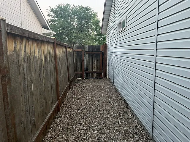 Gate off other side of house offers privacy and safety from wondering kids or critters!