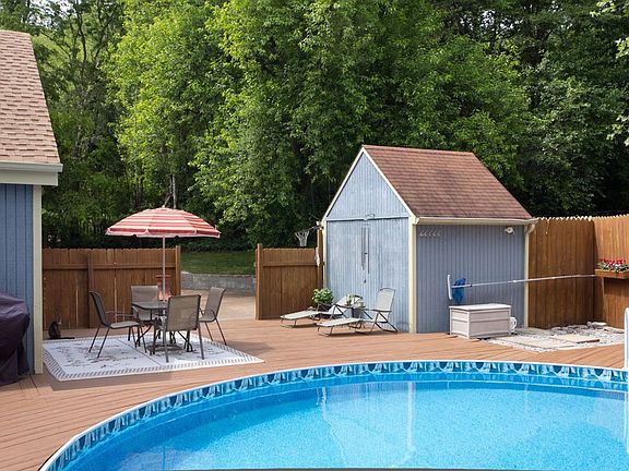 Pool with Hot Tub Area and Backyard