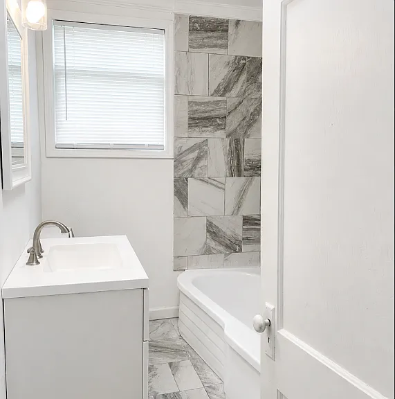 Original vingtage bathtub. New toilet, vanity, and window. New tile throughout. 

Photo Note: Photos have been lightly enhanced to improve lighting and image quality. Colors, finishes, and exterior conditions may vary slightly during in-person viewing.