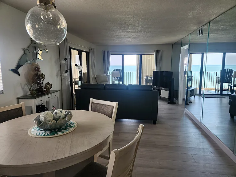 New table under Dolphin mirror to display beautiful pieces of Art and decor we purchased from local small businesses .