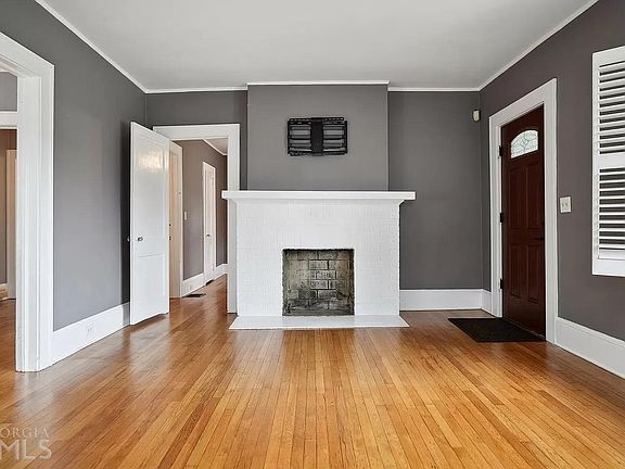 Living room with TV mount above fireplace.