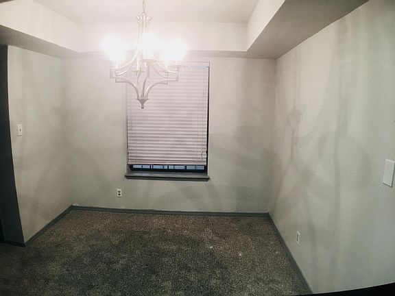 Dining room with modern light fixture