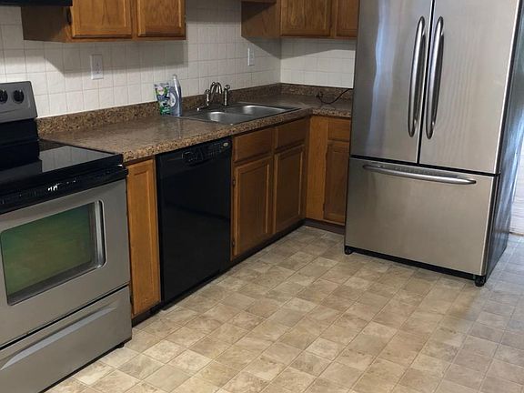 kitchen + more counter & cabinets on opposite wall