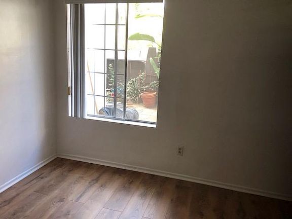 Bedroom window opens onto the closed patio