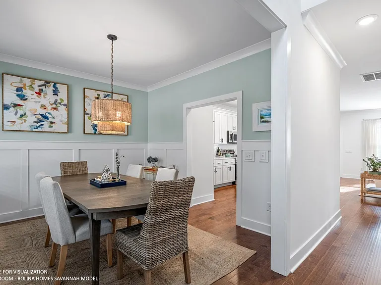 DINING ROOM PICTURE FROM A DIFFERENT SAVANNAH MODEL RECENTLY BUILT BY ROLINA HOMES