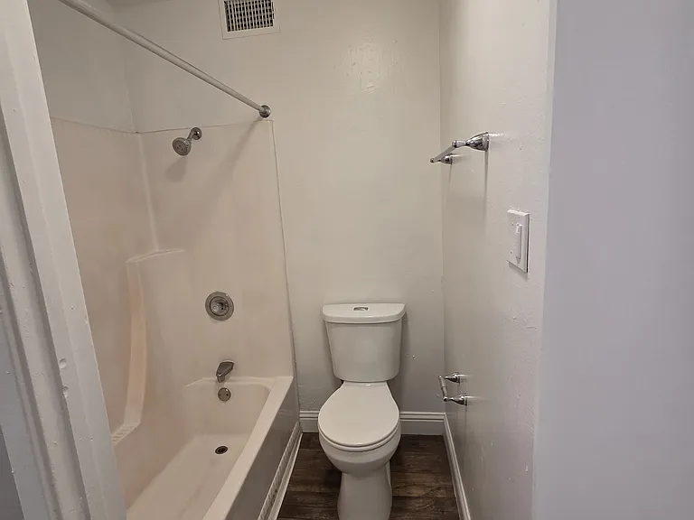 bathroom unit 57. Though bathrooms are the same in all other 1 bedrooms with the exception of the floor coloring, most are a grey wood-like vinyl plank